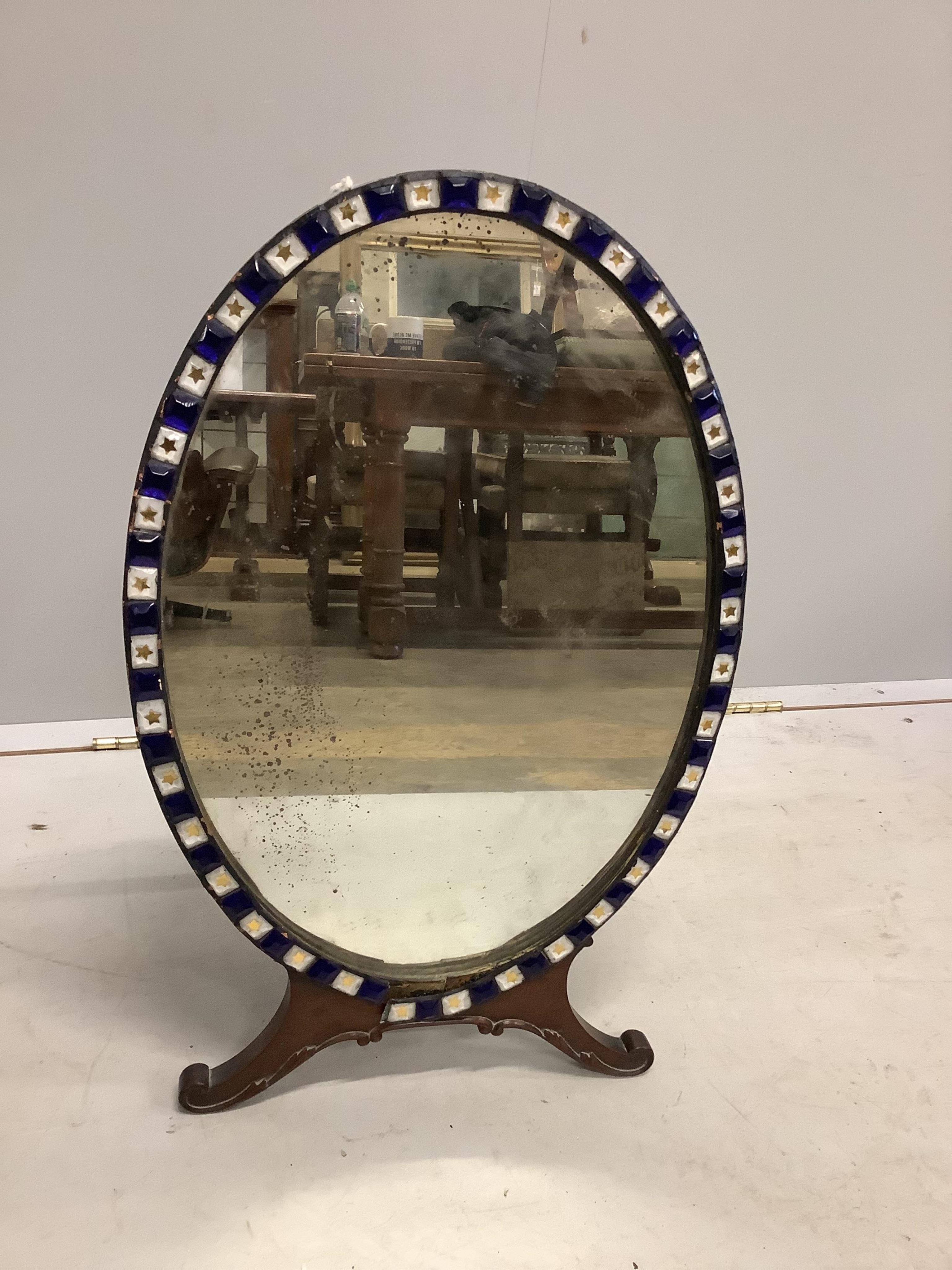 An Irish style oval strut dressing table mirror, width 40cm, height 64cm. Condition - fair